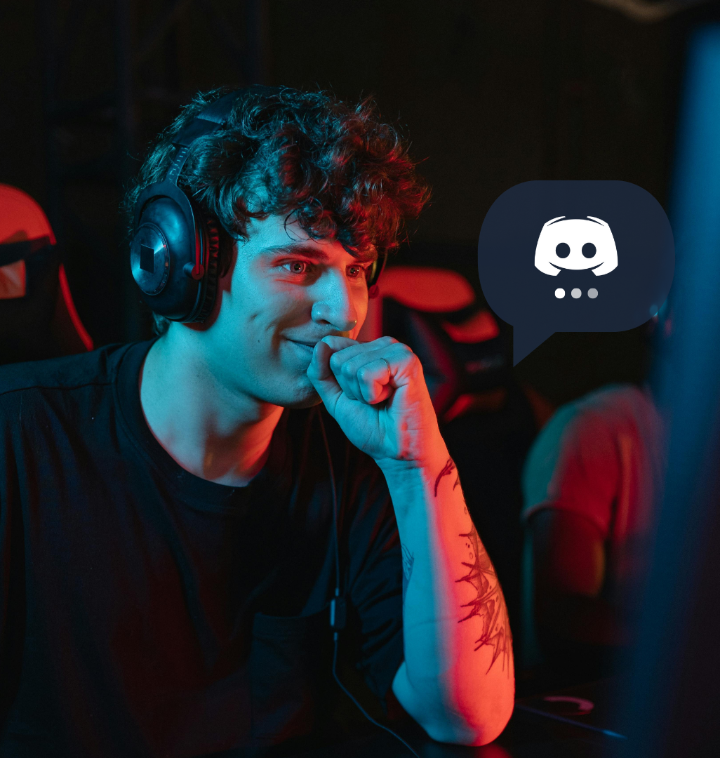 A happy man looking at a computer